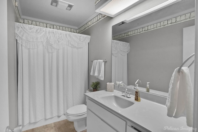 full bathroom with shower / tub combo, toilet, wood-type flooring, vanity, and ornamental molding