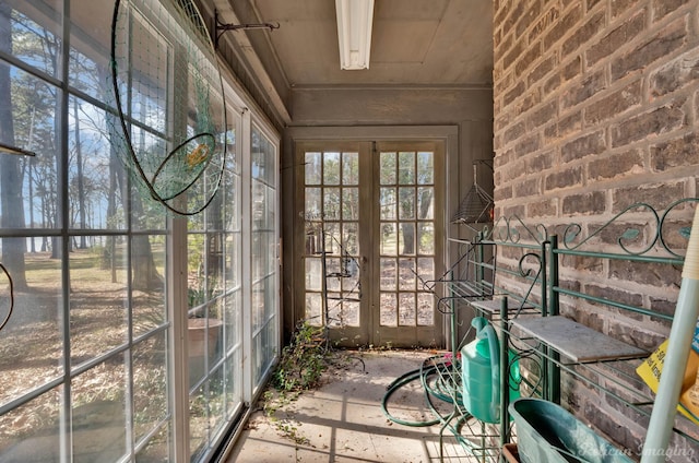 unfurnished sunroom with french doors