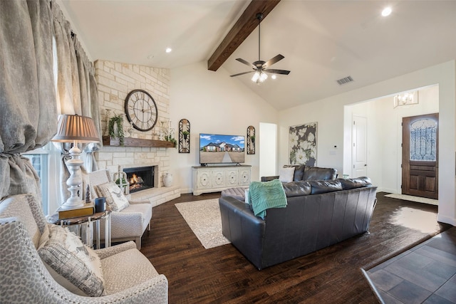 living room featuring lofted ceiling with beams, a stone fireplace, ceiling fan, and dark wood-type flooring