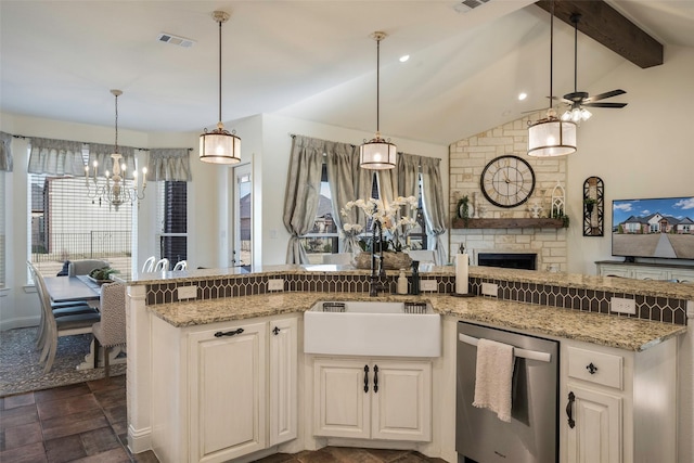 kitchen featuring white cabinetry, ceiling fan, hanging light fixtures, and lofted ceiling with beams