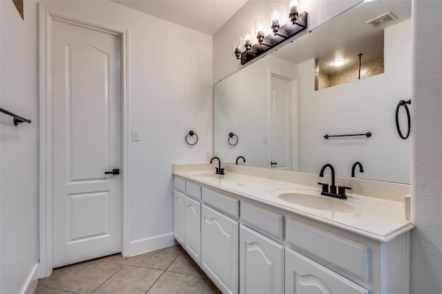 bathroom with vanity and tile patterned floors