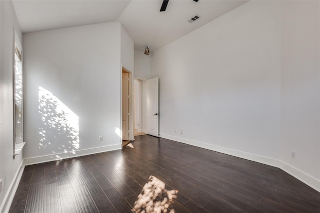 unfurnished room featuring dark hardwood / wood-style floors, ceiling fan, and lofted ceiling