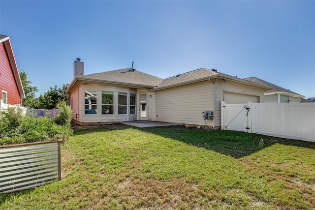 rear view of house featuring a lawn