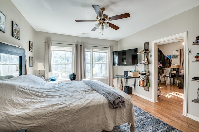 bedroom featuring ceiling fan and light wood-type flooring