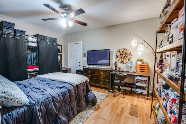 bedroom featuring ceiling fan and light hardwood / wood-style floors