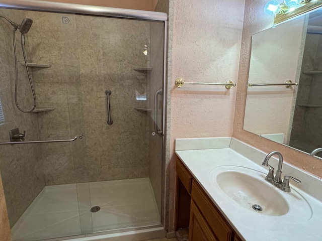 bathroom with vanity and an enclosed shower