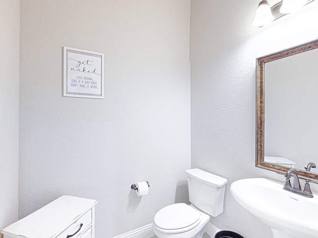 bathroom with sink and toilet