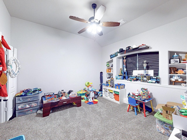 recreation room featuring ceiling fan, carpet, and lofted ceiling