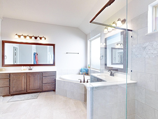 bathroom featuring tile patterned flooring, plus walk in shower, vaulted ceiling, and vanity