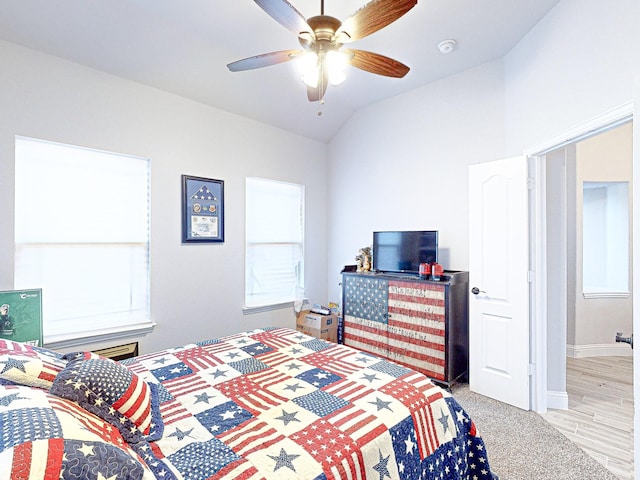 bedroom featuring ceiling fan and vaulted ceiling