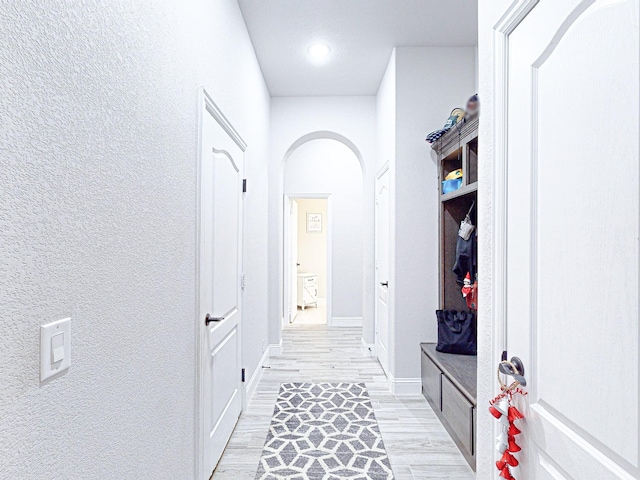 hallway with light wood-type flooring