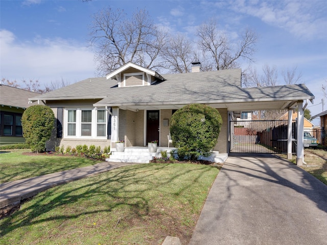 bungalow-style house featuring a front yard and a carport