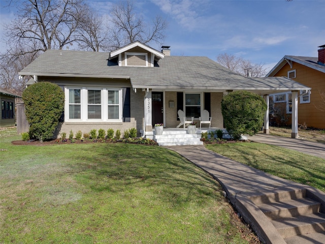 bungalow with a front lawn and a porch