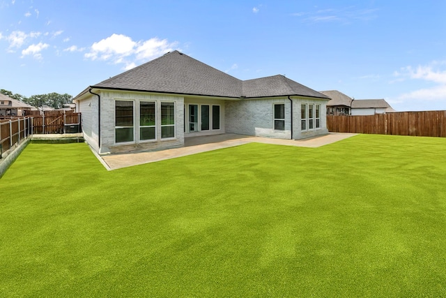 220 Magnolia Dr, Azle, TX 76020 - back of house featuring a patio area, roof with shingles, and brick siding