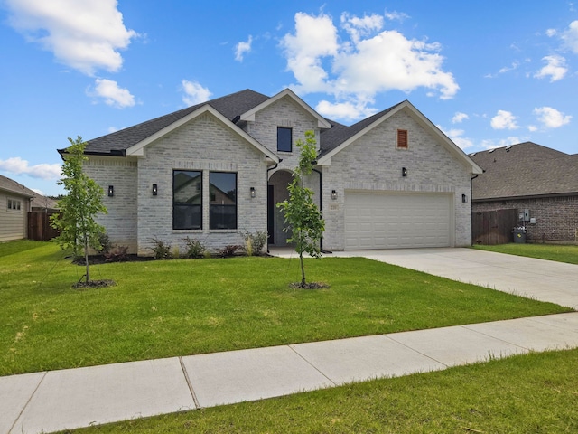 220 Magnolia Dr, Azle, TX 76020 - view of front of property with concrete driveway, brick siding, and a garage