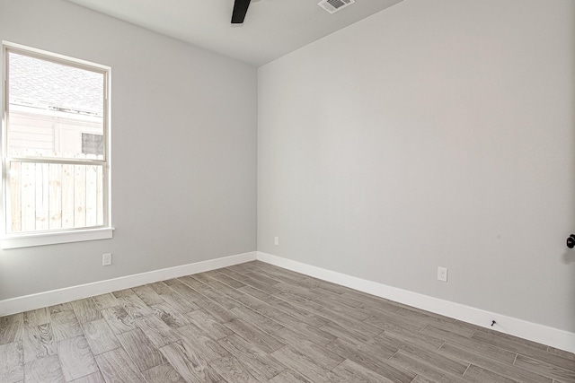 spare room with light hardwood / wood-style floors