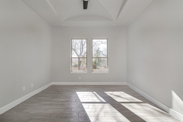 empty room with ceiling fan and light wood-type flooring