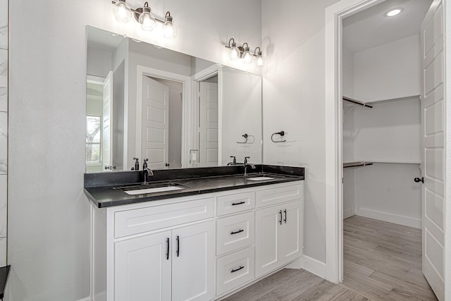 bathroom featuring vanity and wood-type flooring