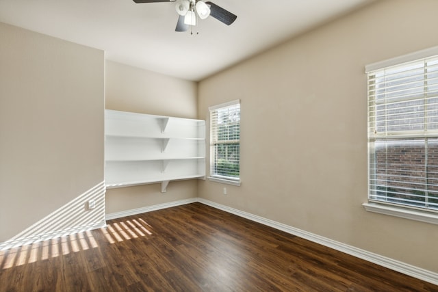 unfurnished room featuring ceiling fan and dark hardwood / wood-style floors