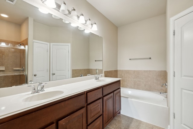 bathroom featuring tile patterned floors, vanity, and independent shower and bath