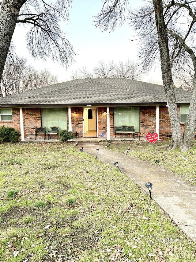 ranch-style house with a front yard