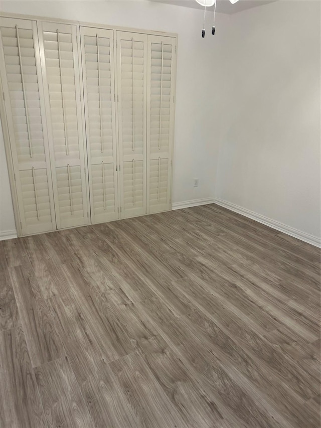 unfurnished bedroom featuring hardwood / wood-style flooring