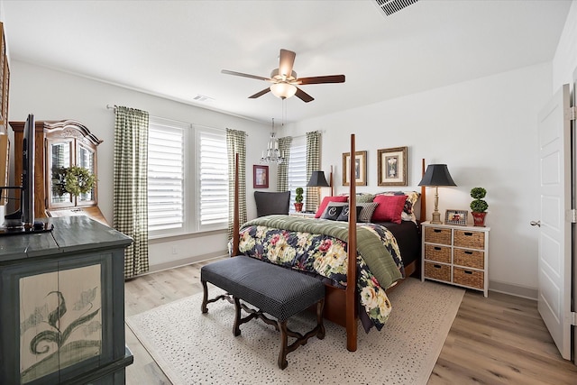 bedroom featuring hardwood / wood-style floors and ceiling fan