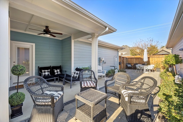 view of patio with outdoor lounge area and ceiling fan