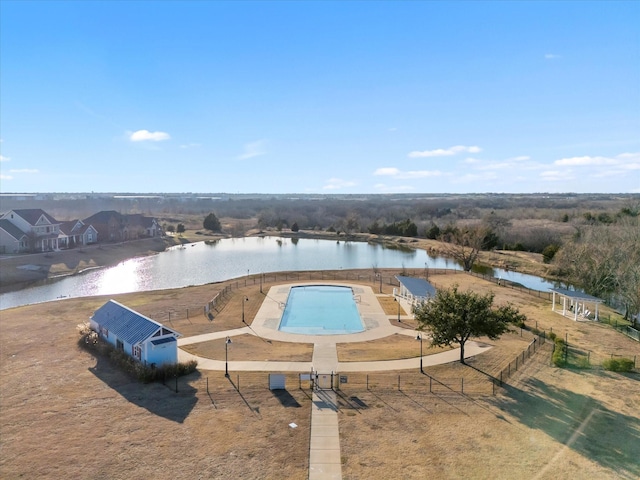 view of swimming pool featuring a water view