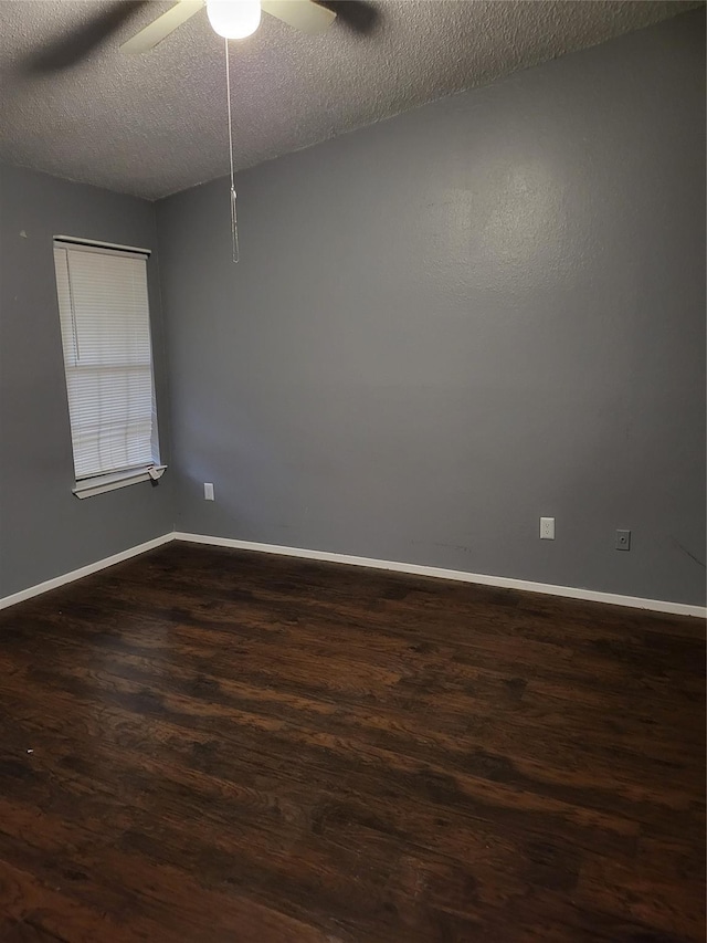 unfurnished room featuring ceiling fan, dark hardwood / wood-style flooring, and a textured ceiling