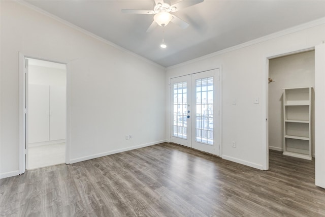 empty room featuring ceiling fan, french doors, wood-type flooring, and ornamental molding