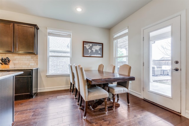 dining room with dark wood-type flooring