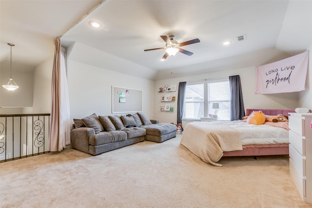 bedroom featuring ceiling fan, light colored carpet, and lofted ceiling