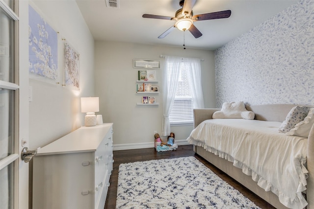 bedroom featuring ceiling fan and dark hardwood / wood-style flooring