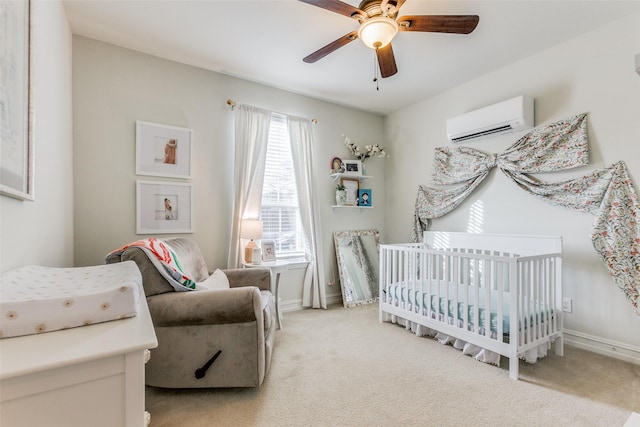 bedroom featuring a crib, multiple windows, an AC wall unit, and ceiling fan