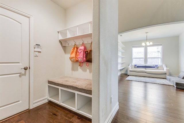 mudroom featuring dark hardwood / wood-style flooring and a chandelier