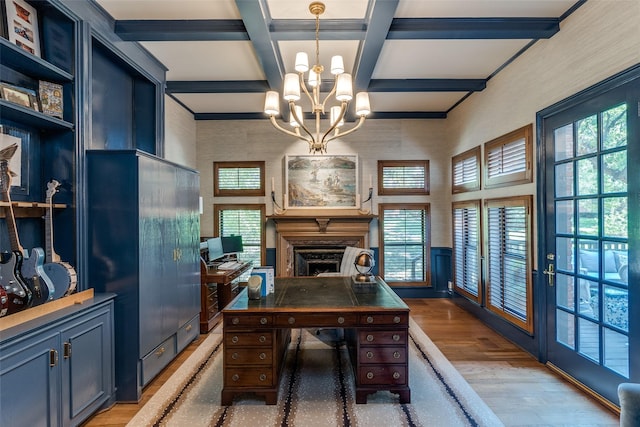 office area with french doors, an inviting chandelier, hardwood / wood-style flooring, beam ceiling, and coffered ceiling