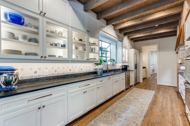 kitchen featuring white cabinetry, tasteful backsplash, light wood-type flooring, wooden ceiling, and beam ceiling