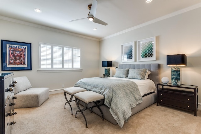 carpeted bedroom with ceiling fan and crown molding