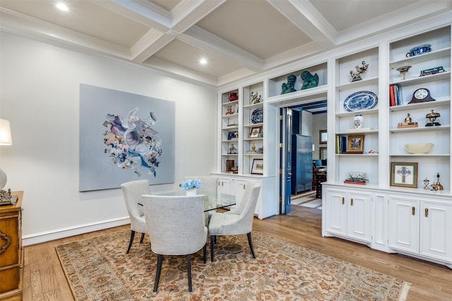 dining room featuring built in shelves, beamed ceiling, light hardwood / wood-style flooring, crown molding, and coffered ceiling