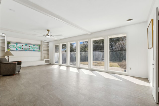 unfurnished living room with beam ceiling and ceiling fan