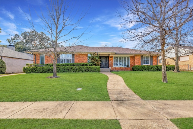 single story home featuring a front lawn