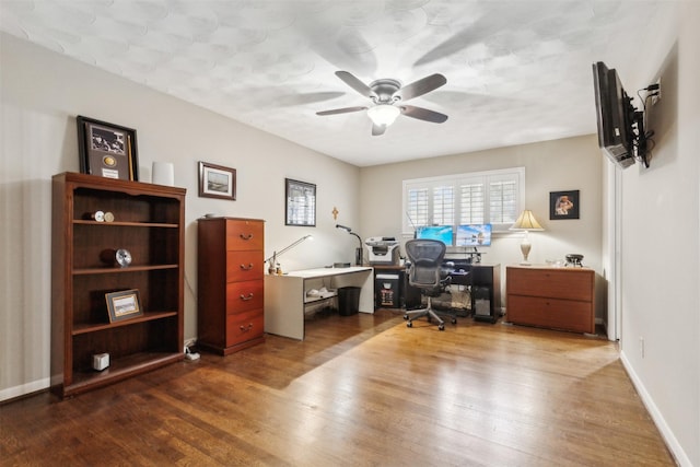 office with ceiling fan and hardwood / wood-style floors