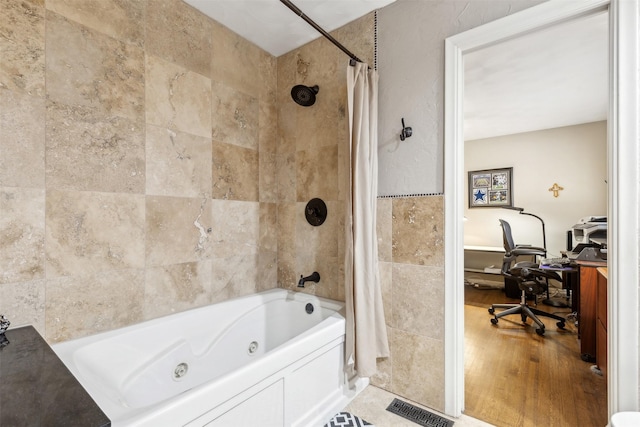 bathroom featuring wood-type flooring and shower / tub combo with curtain