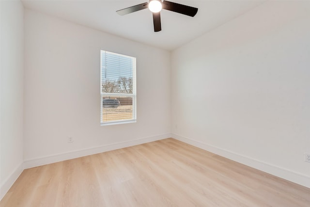 spare room featuring light hardwood / wood-style flooring and ceiling fan