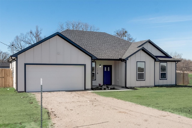 view of front facade with a front lawn and a garage