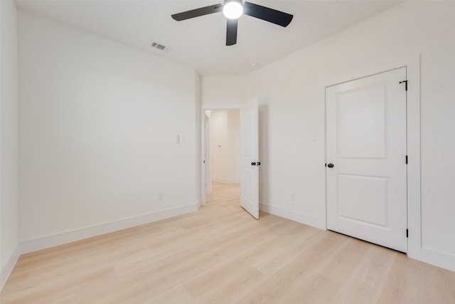 unfurnished bedroom featuring light hardwood / wood-style flooring and ceiling fan