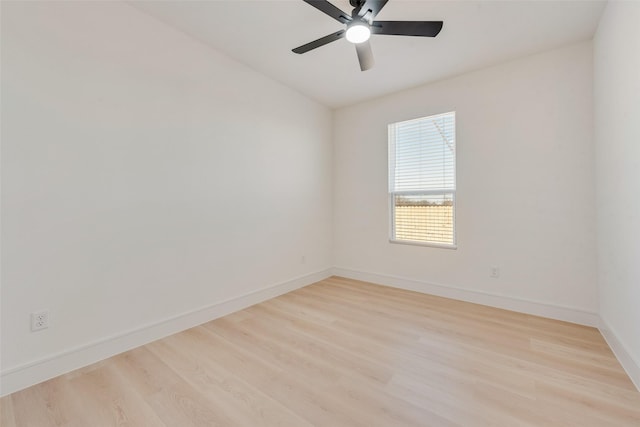 empty room with light hardwood / wood-style floors and ceiling fan