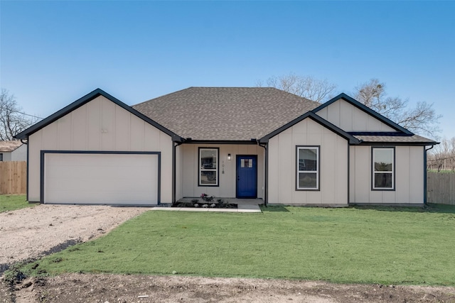 view of front of house with a garage and a front lawn