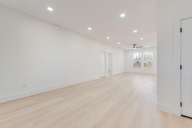 unfurnished room featuring light wood-type flooring and ceiling fan